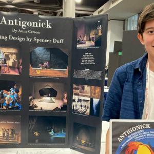 Spencer Duff holding an award.