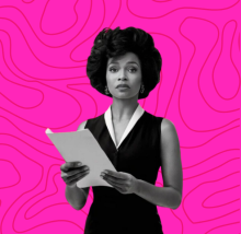 A woman holding a piece of paper