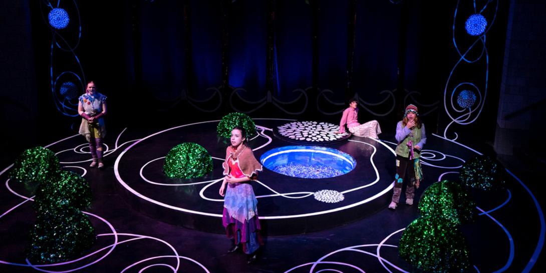 Four actors in a neon room with various shapes.