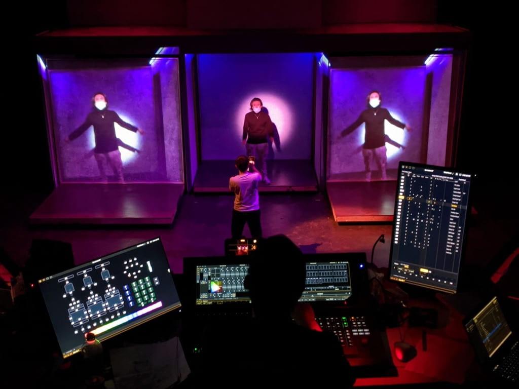 Capturing the magic behind the scenes: A skilled student lighting designer at work in a technical rehearsal for Open Up! — a devised student variety showcase.