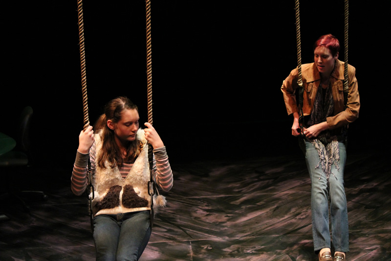 Lehigh University Theatre - Two people sitting on swings