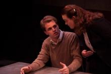 Lehigh University Theatre - The Pillowman, man sitting with woman talking to him