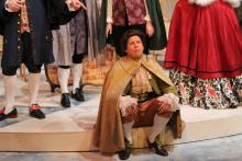 Lehigh University Theatre - The Belle's Stratagem, man sitting on edge of stage