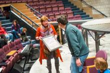 Lehigh University Theatre - Mark Hollmann Visits Lehigh, woman holding frame