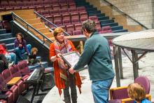 Lehigh University Theatre - Mark Hollmann Visits Lehigh, woman giving out frame