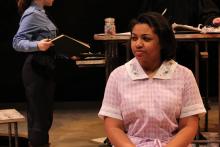 Lehigh University Theatre - The Last Days of Judas Iscariot, woman sitting looking skeptical